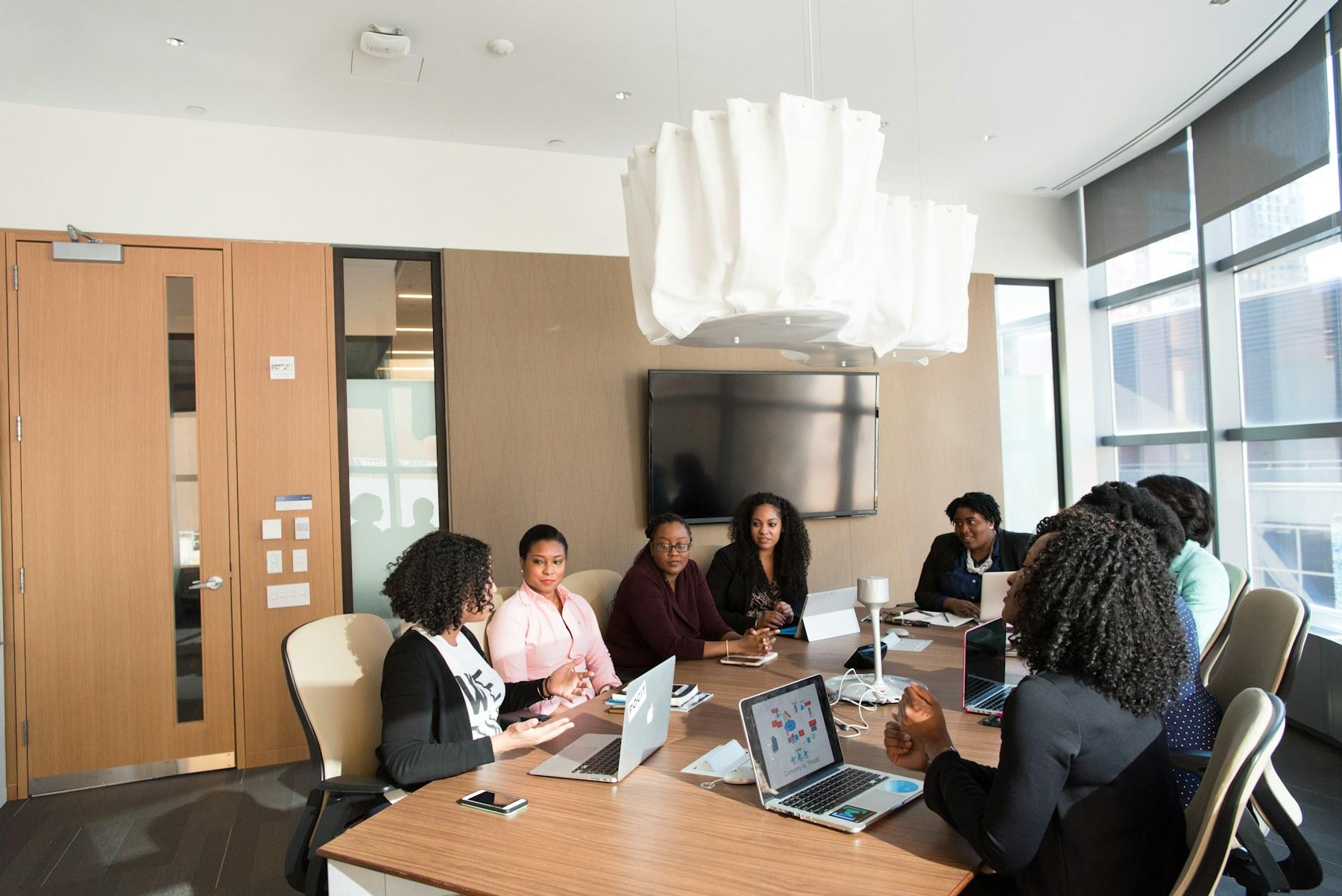 Diverse professionals in a boardroom strategy discussion